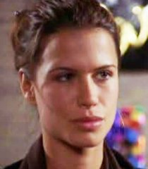 Holly Marie Beggins (Rhona Mitra)