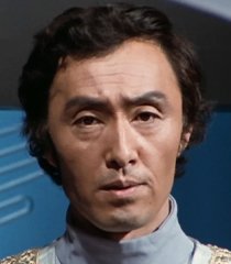 Comandante Kom (Toshiaki Nishizawa)